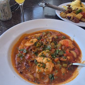 The Butter House - Shrimp and grits with a mimosa. - Breakfast & Brunch Near Me - Seaside, California The Butter House - Shrimp and grits with a mimosa. - Breakfast & Brunch Near Me - Seaside, California