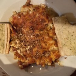 Luigi's Pizza - BAKED MAC AND CHEESE large corkscrew pasta tossed in a four cheese cream sauce and baked with garlic bread crumbs