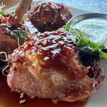 El Moro Spirits & Tavern - Chicken Honey-Sambal Lollipops up close.  These sauces are unreal - New American Near Me - Durango, Colorado