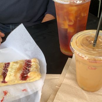 Comic Coffeehouse - Iced passion fruit tea with raspberry danish and iced oat milk  sugar free caramel latte. - Comic Books Near Me - Olathe, Kansas
