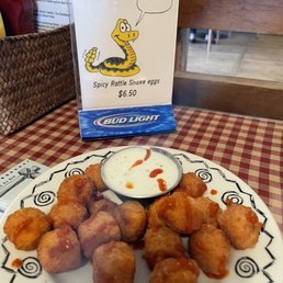 Menu sign with the fried snake eggs. Menu sign with the fried snake eggs.