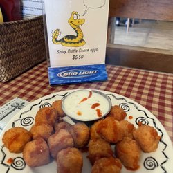 Stampede Saloon And Eatery - Menu sign with the fried snake eggs.
