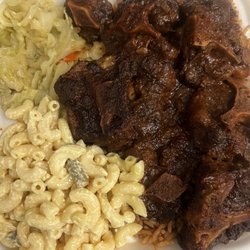 Tropical Paradise - Oxtail, cabbage, mac salad, rice and peas
