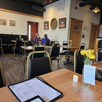 Potsticker - a woman sitting at a table in a restaurant - Asian Fusion Near Me - Saint Paul, Minnesota Potsticker - a woman sitting at a table in a restaurant - Asian Fusion Near Me - Saint Paul, Minnesota