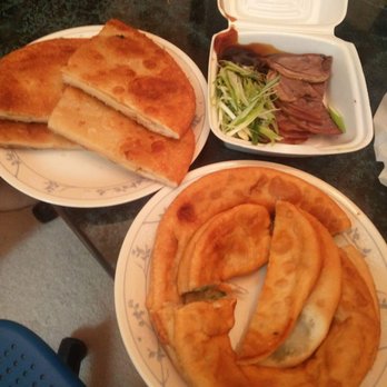 New Northern Dumplings - Takeout: beef pancake (top - both) and green onion pancake (bottom right) - Chinese Near Me - Scarborough, Ontario New Northern Dumplings - Takeout: beef pancake (top - both) and green onion pancake (bottom right) - Chinese Near Me - Scarborough, Ontario