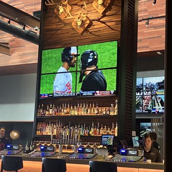 Redwood Taphouse - Center bar w/ sports action screen(s) - Sports Bars Near Me - Porterville, California Redwood Taphouse - Center bar w/ sports action screen(s) - Sports Bars Near Me - Porterville, California