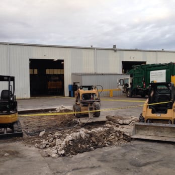 Full Moon Builders - construction equipment in front of a building - General Contractors Near Me - Houston, Texas Full Moon Builders - construction equipment in front of a building - General Contractors Near Me - Houston, Texas