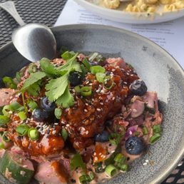 Korean Fried Chicken with kimchi and cucumber slaw and pickled blueberries. Korean Fried Chicken with kimchi and cucumber slaw and pickled blueberries.