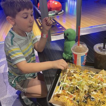 Alley Cats Entertainment - Giant nachos delivered to the bowling lane. Friendly service and clean location - Arcades Near Me - Hurst, Texas