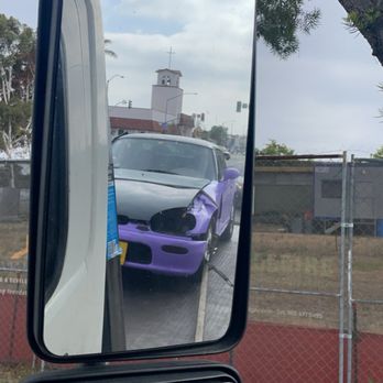 J&H Towing - Car secured on tow bed with hood strapped down - Towing Near Me - San Diego, California J&H Towing - Car secured on tow bed with hood strapped down - Towing Near Me - San Diego, California
