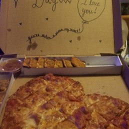 Heart shaped pepperoni and sausage pizza, with fried ravioli