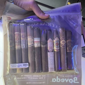 Xavier's Cigar Lounge - a hand holding a package of cigars - Cigar Bars Near Me - Hallandale Beach, Florida Xavier's Cigar Lounge - a hand holding a package of cigars - Cigar Bars Near Me - Hallandale Beach, Florida