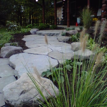 Poole's Stone & Garden - a stone path leading to a log cabin - Landscaping Near Me - Frederick, Maryland Poole's Stone & Garden - a stone path leading to a log cabin - Landscaping Near Me - Frederick, Maryland
