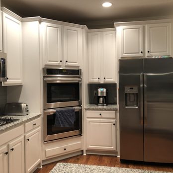 LeoYsa Home Improvements - a kitchen with stainless steel appliances - Painters Near Me