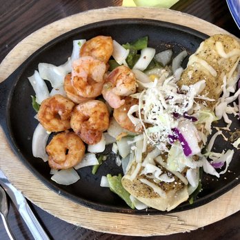 El Torito - Flavorless sautéed shrimp on what was described as fajita veggies. Next to a chicken enchilada The other half of the "Sizzling Combo." - Mexican Near Me - Sherman Oaks, California