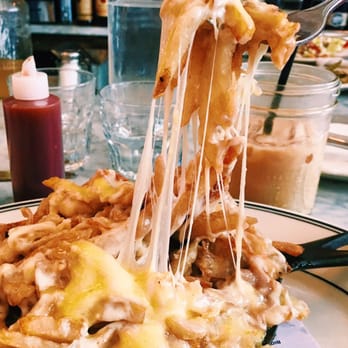 Jacob's Pickles - Poutine with brown gravy, cheese and hollandaise sauce. - Comfort Food Near Me - New York, New York Jacob's Pickles - Poutine with brown gravy, cheese and hollandaise sauce. - Comfort Food Near Me - New York, New York