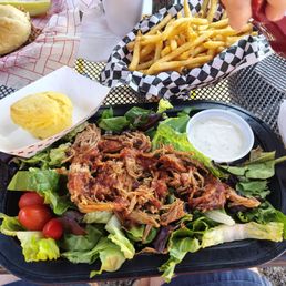 pulled pork salad and basket of fries pulled pork salad and basket of fries