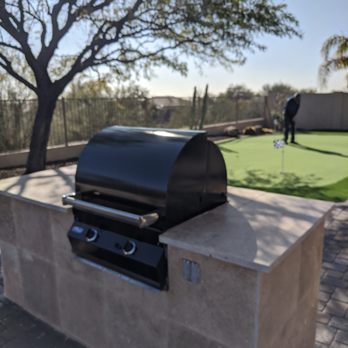 Synthetic Grass Masters - travertine BBQ island includes two electrical plugs and counter lip to clamp on light for night grilling - Artificial Turf Near Me - Scottsdale, Arizona Synthetic Grass Masters - travertine BBQ island includes two electrical plugs and counter lip to clamp on light for night grilling - Artificial Turf Near Me - Scottsdale, Arizona