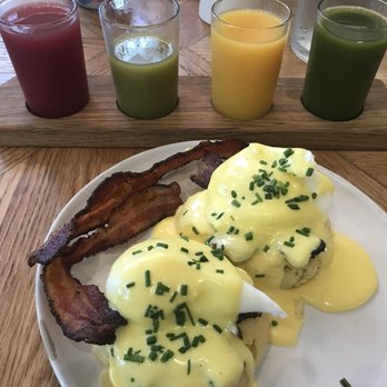 Magnolia Table - Farm Eggs Benedict with a side of peppered bacon and the Juice Flight - Breakfast & Brunch Near Me - Waco, Texas