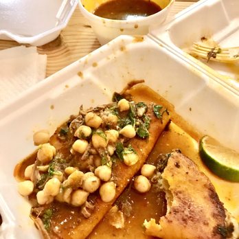 The Spot Tacos and More - Birria tacos with consommé - inside the consommé are chick peas and seasons which you see on top here. - Mexican Near Me - Bradenton, Florida