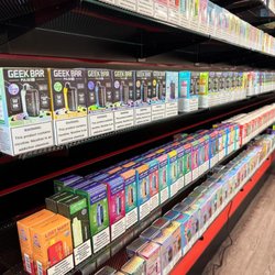 Red Star Vapor & Smoke - Product - Disposable vape wall featuring Geek Bar Pulse X, Lost Mary, RAZ, and Off-Stamp disposables.