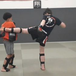 Beltrante Fighting Systems - Youth Muay Thai class practicing body kicks!!
