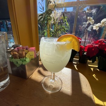 The Shed - Beautiful view of both my Mezcal margarita and the courtyard from our table for two.. - New Mexican Cuisine Near Me - Santa Fe, New Mexico The Shed - Beautiful view of both my Mezcal margarita and the courtyard from our table for two.. - New Mexican Cuisine Near Me - Santa Fe, New Mexico