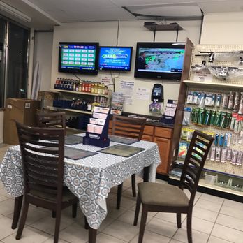 Quick Food - a table and chairs in a store - Convenience Stores Near Me - Winthrop, Massachusetts