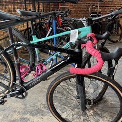 Bicycle World - Checkpoint SL 5 AXS Gen 3 - tricked out with hot pink bar tape and cages