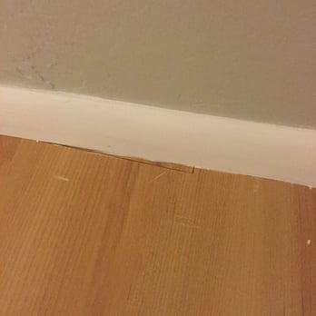 Reinhard Demant Construction - Small piece of flooring installed sloppy. - General Contractors Near Me - Tucson, Arizona