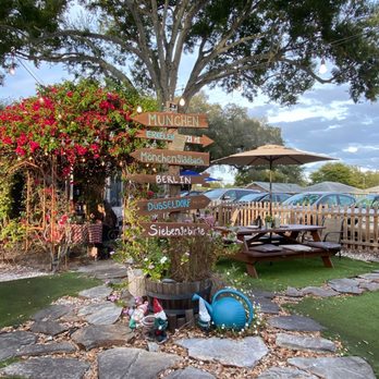 Siegfried's Restaurant - Outdoor patio that consists mostly of picnic tables.   All cooking is done in a trailer in the yard - German Near Me - Sarasota, Florida