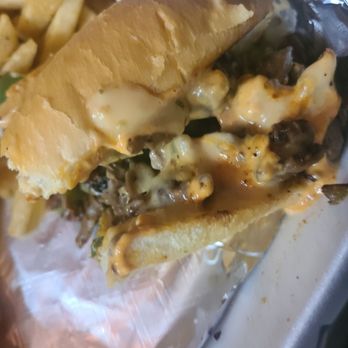 Love C Spot - Half eaten philly cheesesteak - Tacos Near Me - Austin, Texas
