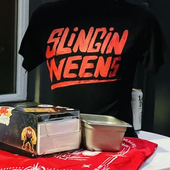 Cholo Dogs - a t - shirt and a box of hot dogs - Hot Dogs Near Me