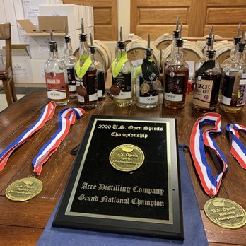 Acre Distilling Co. - a table with bottles of liquor - Cocktail Bars Near Me - Fort Worth, Texas Acre Distilling Co. - a table with bottles of liquor - Cocktail Bars Near Me - Fort Worth, Texas