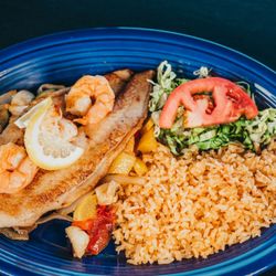 Gustavo's Mexican Grill - MARISCOLANDIA Delicious scallops, shrimp, and fish with chopped onions, red and yellow peppers, zucchini yellow squash, and mushrooms.