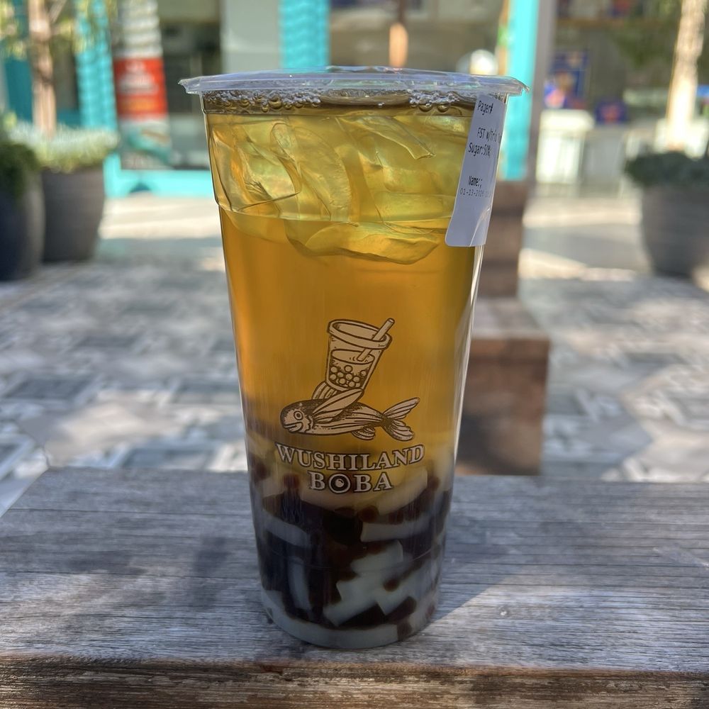 Four seasons tea with trio topping - boba, pearl, and coconut jelly Four seasons tea with trio topping - boba, pearl, and coconut jelly