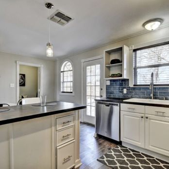 Unison Way - a kitchen with stainless steel appliances - General Contractors Near Me