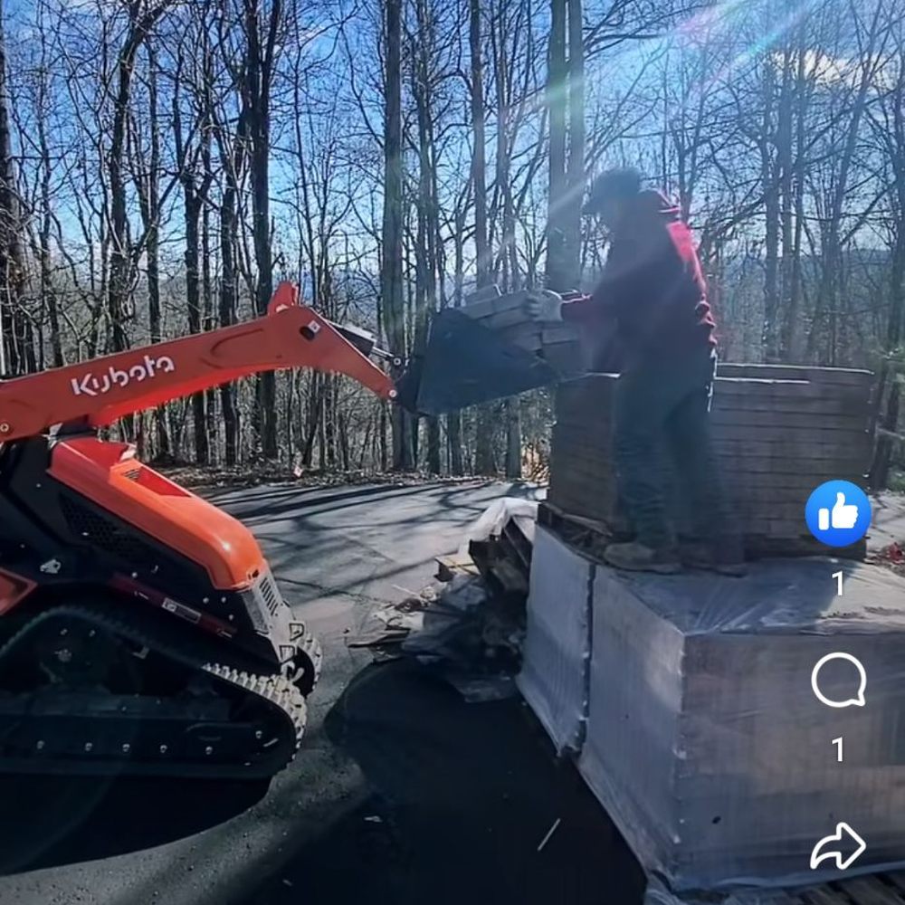 Lion Stone Construction - a person on a snowmobile - Landscaping Near Me Lion Stone Construction - a person on a snowmobile - Landscaping Near Me