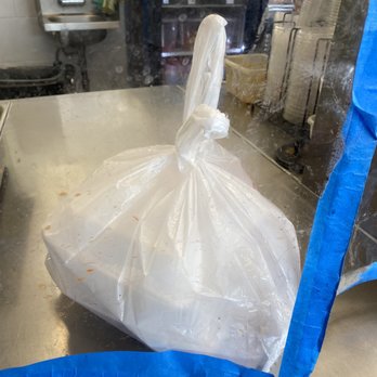 Dragon Garden - Bagged food waiting to be picked up from filth bag through window. - Chinese Near Me - Palmdale, California