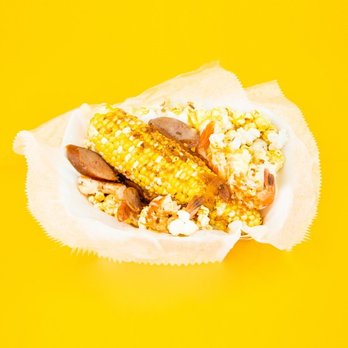 Corneey's - "The Cajun" corn on the cob with sausage and shrimp and popcorn - Popcorn Shops Near Me Corneey's - "The Cajun" corn on the cob with sausage and shrimp and popcorn - Popcorn Shops Near Me