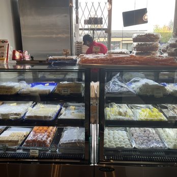 Diya Restaurant And Sweets - a display case with a variety of desserts - Chinese Near Me - Surrey, British Columbia Diya Restaurant And Sweets - a display case with a variety of desserts - Chinese Near Me - Surrey, British Columbia