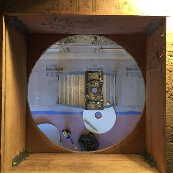 Hayes Construction - a hole in a wall with a mirror - General Contractors Near Me Hayes Construction - a hole in a wall with a mirror - General Contractors Near Me