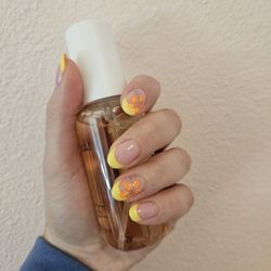Perfect Nails Salon & Spa - Gel manicure with French tip and flower design.