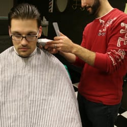 Impeccable Barber Co. - Drew shaping up Rob. Slick back hairstyle cut by Drew.