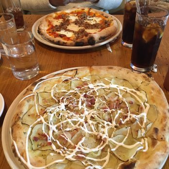 Limestone - Pic of our yummy limestone pizzas! We got one sausage and one called the "spud" with potatoes, bacon and all the yummy goodness. SO GOOD! - Pizza Near Me - Lawrence, Kansas