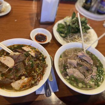 Pho 99 - two bowls of soup with chopsticks - Vietnamese Near Me - Greenville, South Carolina