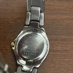 Back and rim all scratched up, even part of the band above.