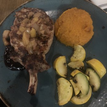 Grillsmith - Autumn menu pork chop. The photo both looked and probably tasted better. This was a disappointment. - American Near Me - Sarasota, Florida