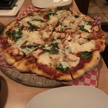 Paliotti's Italian Restaurant - a pizza on a pizza stone - Italian Near Me - Maple Ridge, British Columbia Paliotti's Italian Restaurant - a pizza on a pizza stone - Italian Near Me - Maple Ridge, British Columbia