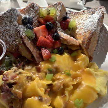 Tostado - French Toast with fruit. Side of scrambled eggs with cheddar cheese and bacon bits. - Breakfast & Brunch Near Me - San Juan, Puerto Rico Tostado - French Toast with fruit. Side of scrambled eggs with cheddar cheese and bacon bits. - Breakfast & Brunch Near Me - San Juan, Puerto Rico